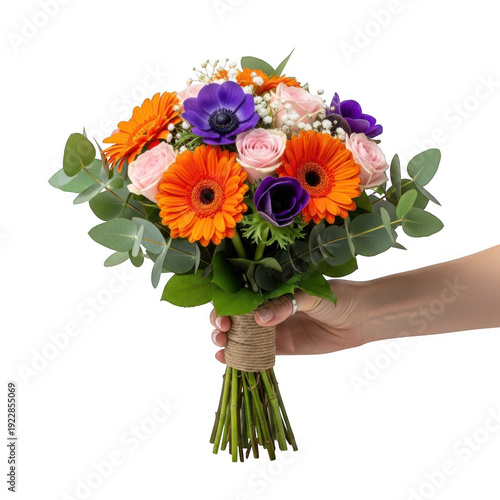 A vibrant bouquet of orange and purple flowers held by a hand isolated on transparent background