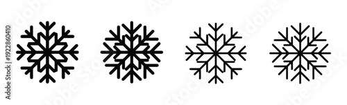 Set of four snowflake icons in solid black and outline, representing winter and cold weather
