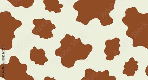 Classic brown and white cow hide seamless pattern texture for rustic western designs and farmhouse themed projects.