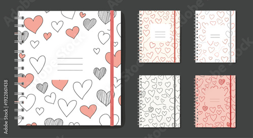 Collection of five spiral bound notebooks with different heart patterns in pink, red, and black on white and pink backgrounds.