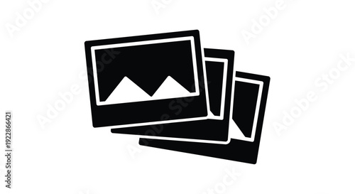 Stack of photographic prints depicted as a simple black and white icon