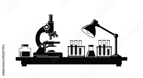 Laboratory equipment including a microscope test tubes and a lamp
