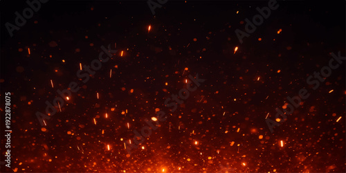 A magic explosion of red and yellow fireworks with bright glowing particles and sparkling glitter creates a festive holiday celebration against a black space night background