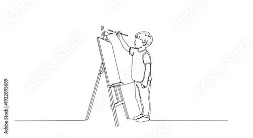 A young boy artist painting on an easel with a brush, celebrating creativity and artistic expression