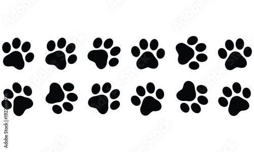 Collection of black cat paw prints on white background arranged in two rows for pet lovers and animal enthusiasts to use in various design projects and creative applications.