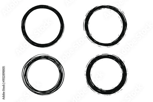 A set of four hand drawn black circles with a brush stroke texture is arranged in a square grid pattern on a solid background, creating a minimalist and artistic graphic design for creative use.