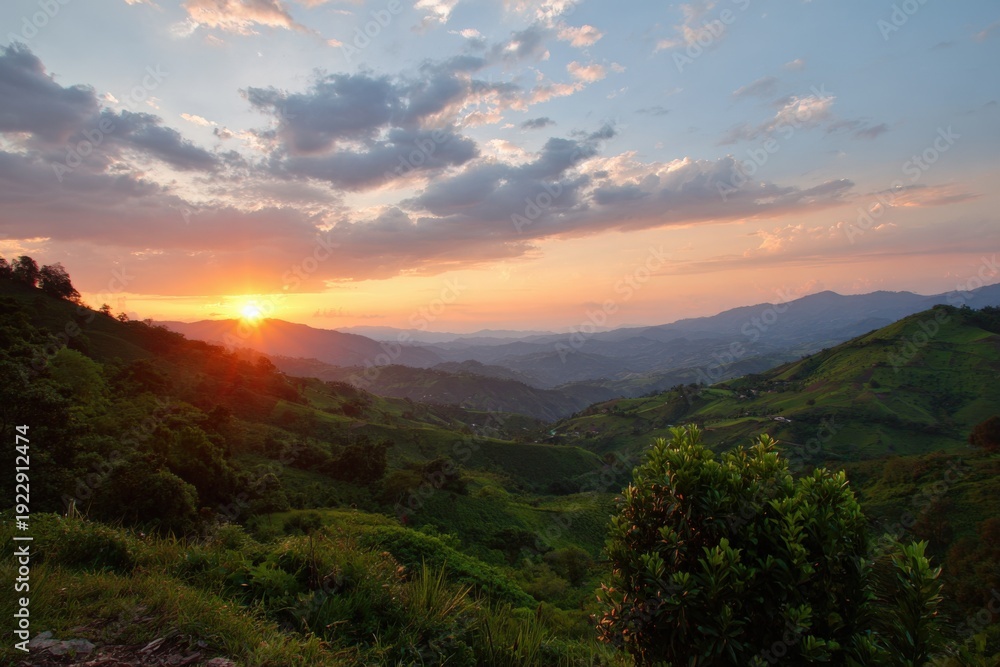 Fototapeta premium Serene mountain sunset over verdant hills and valleys