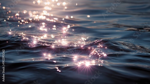 Sunlight reflecting off gentle water ripples creates sparkling, star-like glimmers on the surface of a calm body of water.