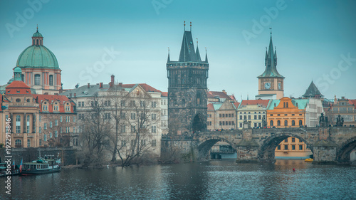 Panoramic view of Charles Bridge and Old Town Bridge Tower in Prague at dusk