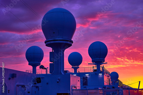 Vibrant Sunset Over Ship's Radomes