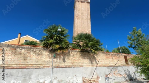 The leaning bell tower on the island of Burano in the Venice lagoon, Italy. Because of land subsidence it is inclined of 1.83 meters respect to its axis.