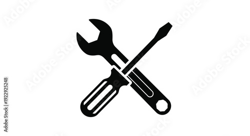 Black silhouette of a wrench and a flathead screwdriver crossed