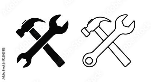 Two sets of crossed tools a wrench and a hammer depicted in black and white