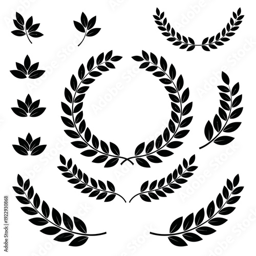 Assortment of black traditional laurel wreaths and decorative leaves on an isolated white background.