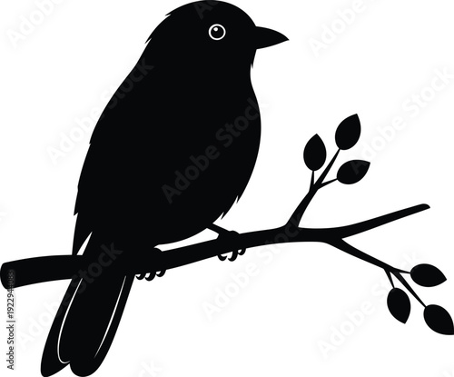 Black silhouette of a bird perched on a branch with leaves