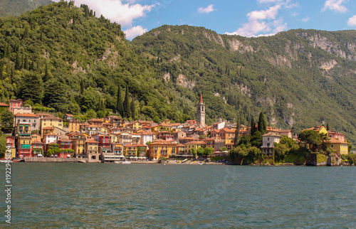 Picturesque village of Varenna seen from Lake Como on sunny day, Lombardy, Italy.