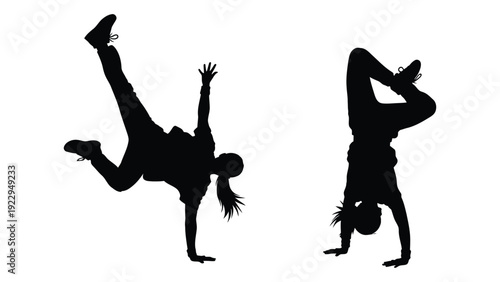 Silhouettes of two people performing acrobatic handstand and breakdance poses