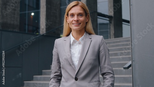 Wallpaper Mural Satisfied glad Caucasian adult business woman in city smiling looking at camera positive cheerful happy middle-aged businesswoman female employer posing near office building look joyful worker lady Torontodigital.ca