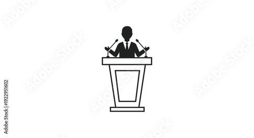 A silhouette of a man stands behind a podium equipped with two microphones, prepared for a speech.