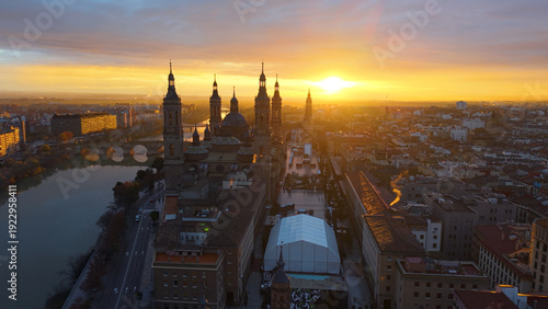 Bild auf Leinwand Aerial View Capturing Sunset Glow Illuminating Cathedral Domes And Tranquil River Reflections