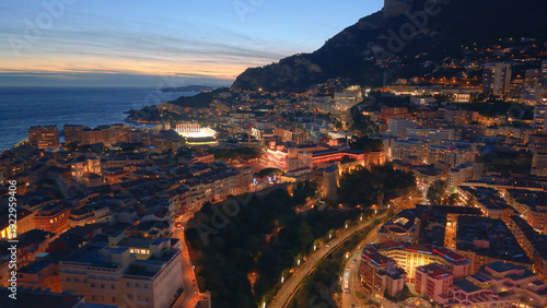 Aerial Cityscape Golden Hour Over Facades, Hillside Skyline And Coastal Bay Drone Sweeps Across Ornate Palace. Monaco