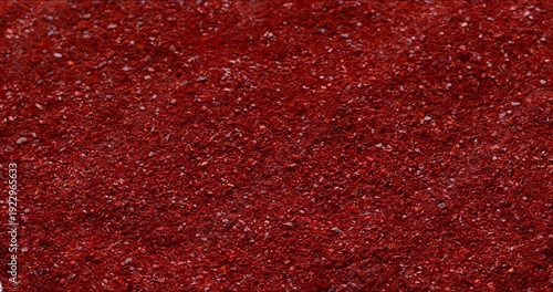 Gochugaru, Korean chili pepper seedless flakes background texture. An important ingredient in kimchi and gochujang paste. Selective focus.
