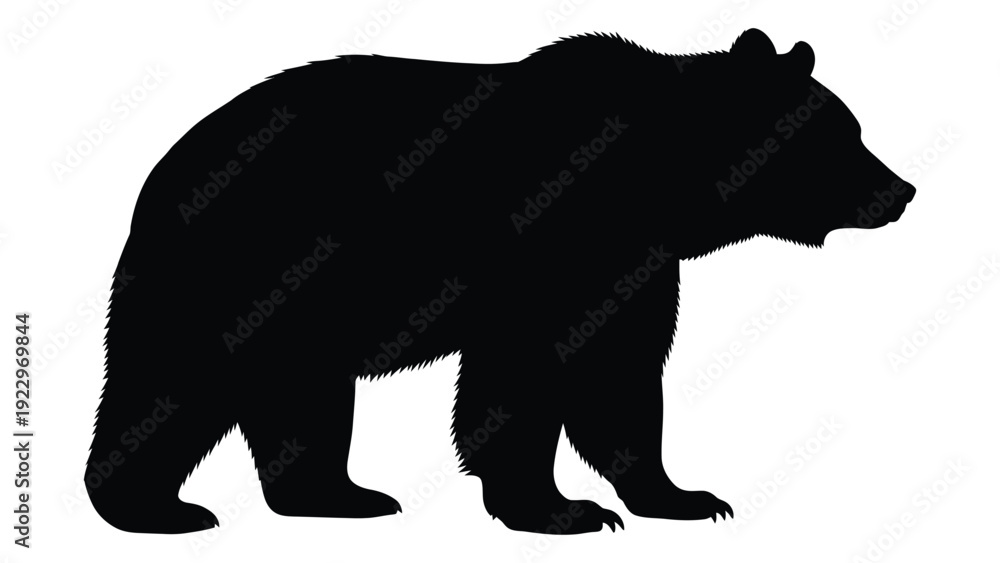 Fototapeta premium A striking silhouette of a brown bear standing in profile against a white background
