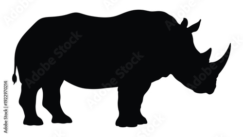 A striking silhouette of a rhinoceros showcasing its powerful form and prominent horn