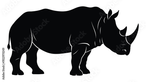 A striking black silhouette of a rhinoceros standing in profile