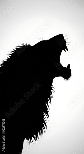 Silhouette of a roaring lion head.