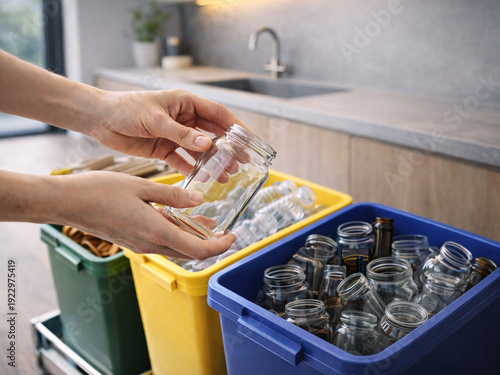 Person sorting glass jars into recycling bin at home, glass recycling and household waste separation concept