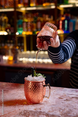 waiter making a Caribbean cocktail