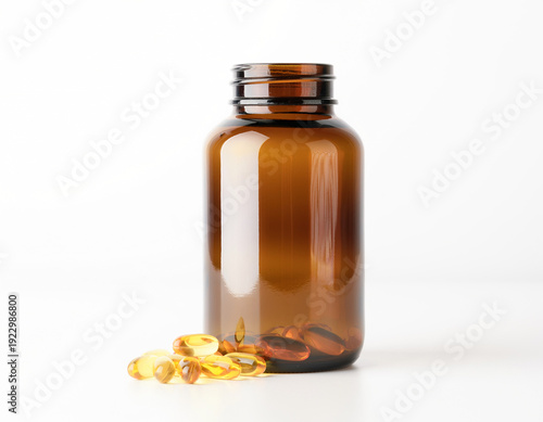 A brown-tinted glass bottle containing fish oil softgel capsules with omega-3 and vitamin D, displayed on a white background.