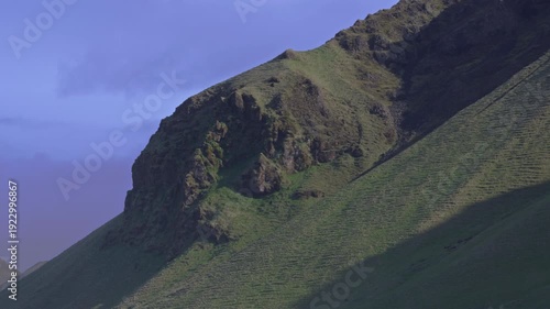 The basalt rock formations above Reynisfjara Beach under the sky