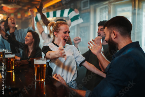 Wallpaper Mural Sports fans celebrating goal cheering watching match in pub Torontodigital.ca