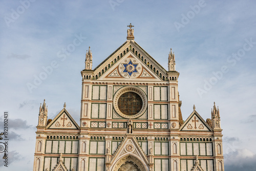 Basilica of Santa Croce with its marble facade on a sunny day in the city of Florence Italy