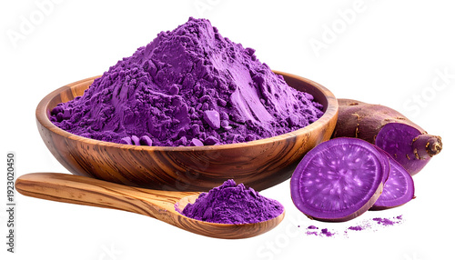 Purple sweet potato powder in a wooden bowl and on a spoon with sliced roots