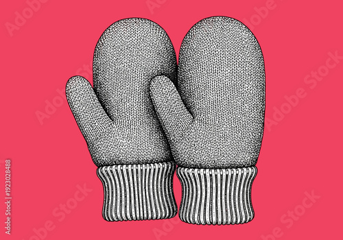 Pair of knitted mittens on a pink background.