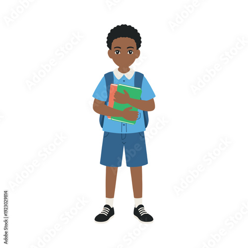 A young boy holding books and wearing a backpack