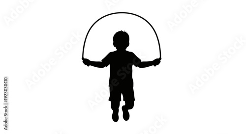 A silhouette of a child jumping with a jump rope outdoors byo