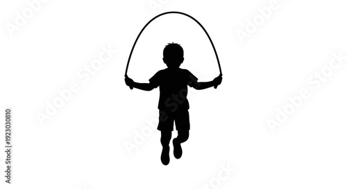 A child jumps with a jump rope in a playful outdoor setting byo