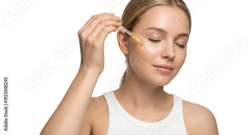 woman applying serum with pipette 
