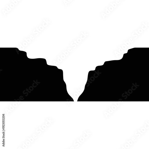 Silhouette of a deep canyon with jagged edges.