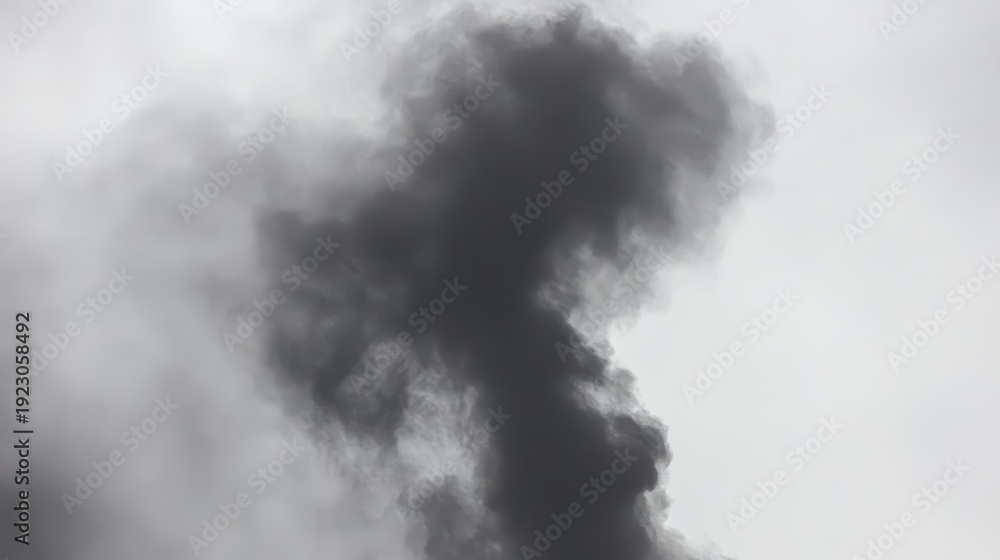 Fototapeta premium Thick dark smoke plumes rising into an overcast sky, symbolizing industrial pollution and its environmental impact.