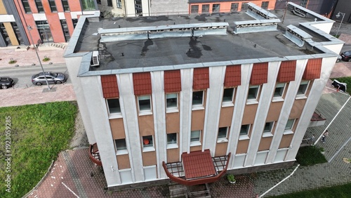 Vászonkép A concrete building (light beige facade) with small loophole windows, built in t