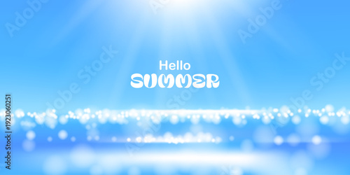 Summer sunny day. Sea, ocean waves with shiny dots, sparkles. Blurred sea horizon with bokeh effect. Blue sky.