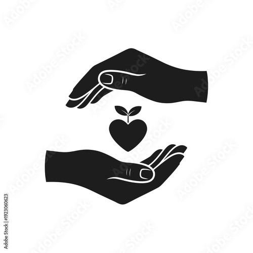 Hands protecting a heart shaped plant seedling.