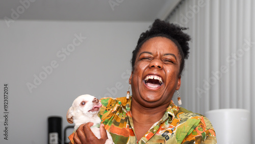 Woman Hugging Small Dog