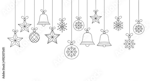 Black and white christmas ornaments and bells hanging from strings