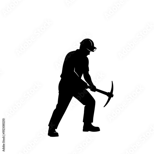 Silhouette of a worker wearing a hard hat and holding a pickaxe, engaged in manual labor or mining activity.